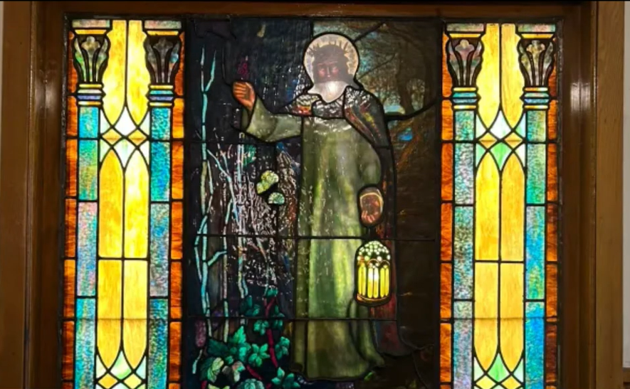 Detail of an original stained glass window inside the church