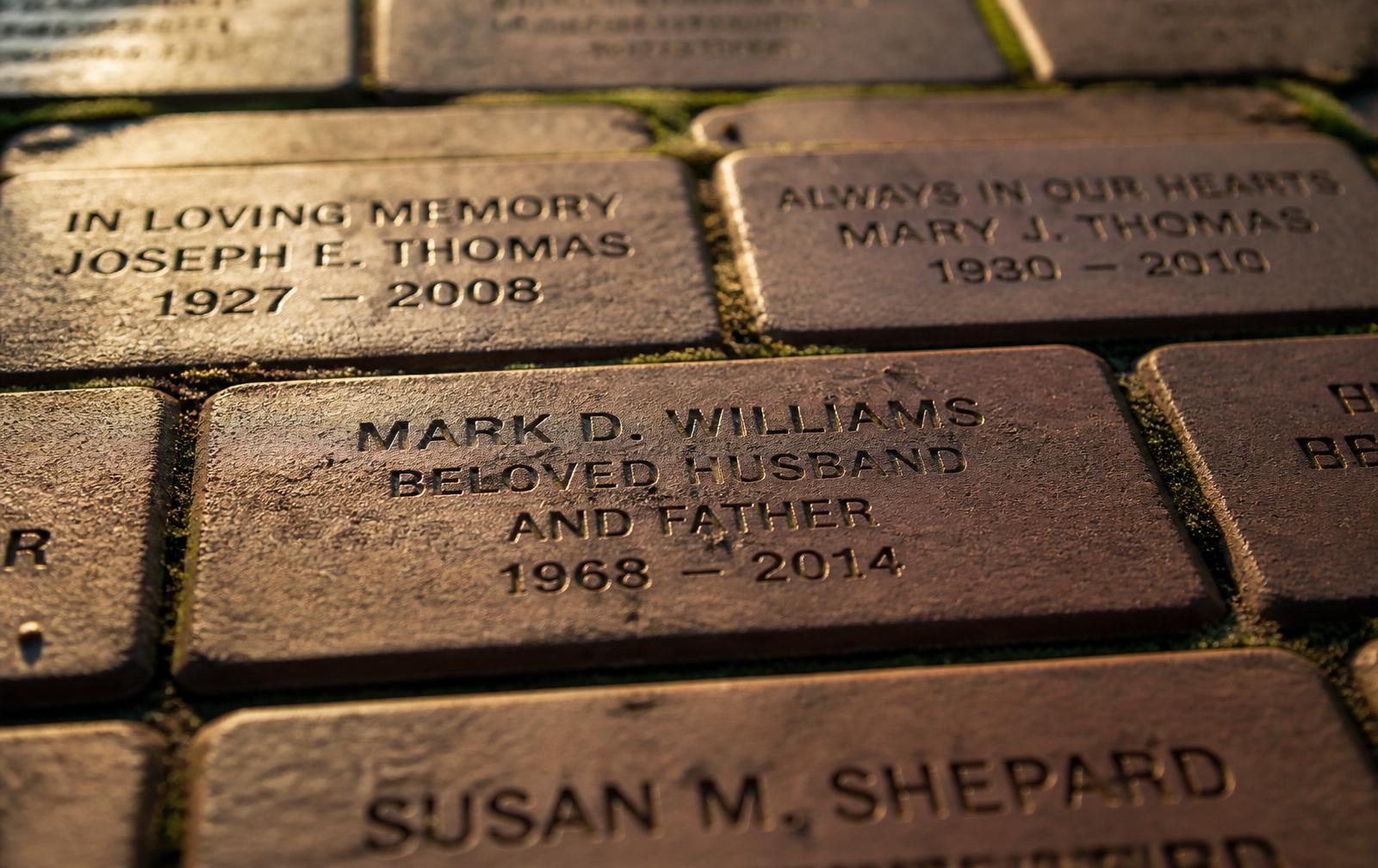 Engraved memorial bricks in a walkway